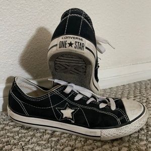 Size 4 in men, 5 1/2 in women, black and white converse sneakers